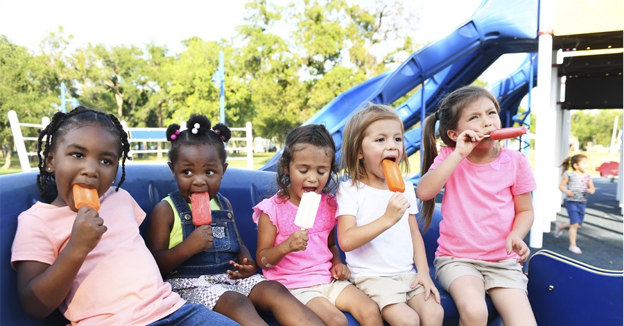 Kids eating ice cream at the park